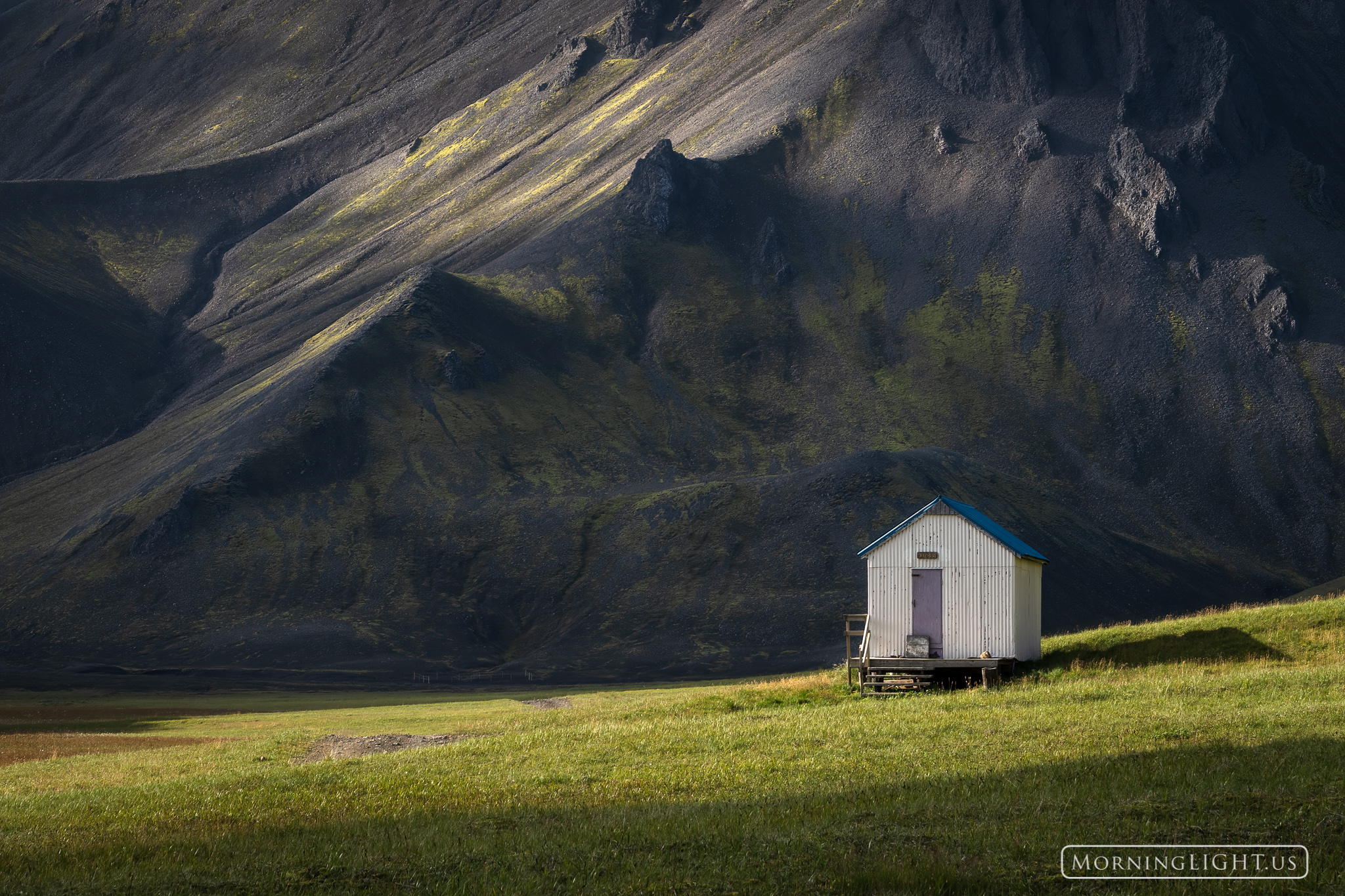 While driving on some back roads in the Icelandic Highlands I came across this small building at the edge of a rugged mountain...